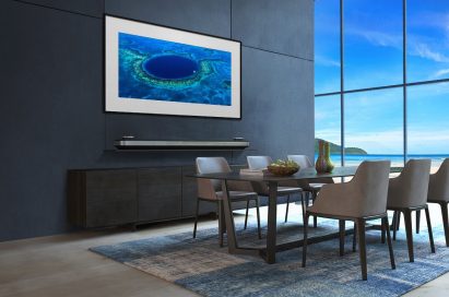 LG SIGNATURE OLED TV W in a modern-designed kitchen displays an image of Belize's Great Blue Hole on its screen.