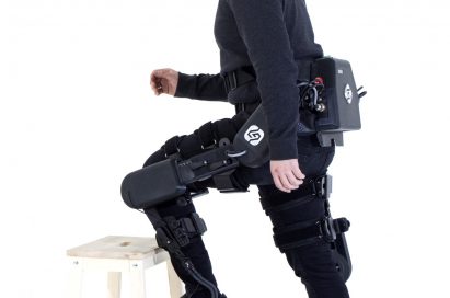 A model poses with SG Robotics equipment.