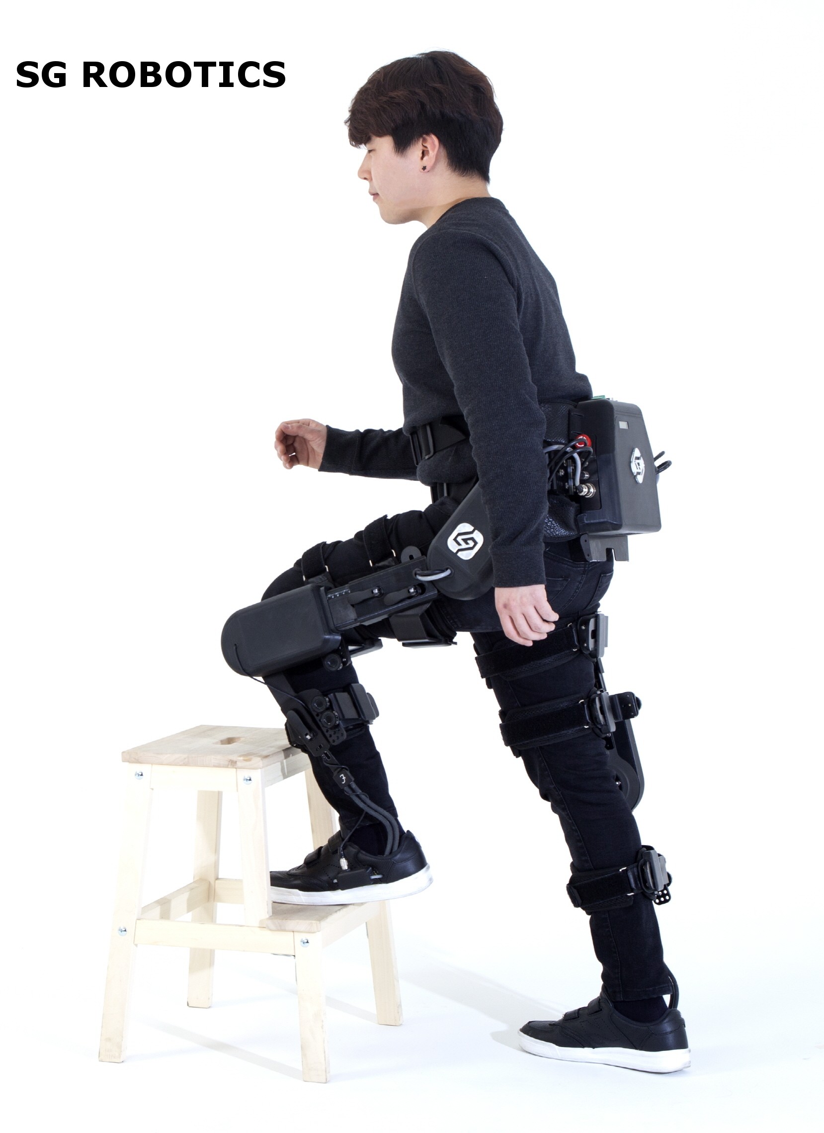 A model poses with SG Robotics equipment.
