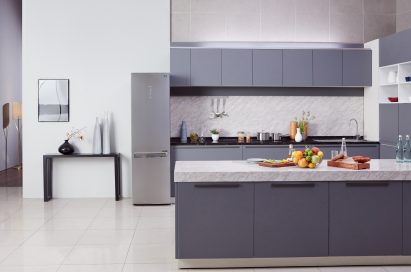 Kitchen with LG Centum System™ bottom-freezer refrigerator in the background