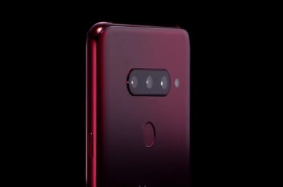 The top, rear half of the LG V40 ThinQ in Carmine Red, showing off the microscopic pits on the rear glass of the LG etched by employing the proprietary Silky Blast™ treatment
