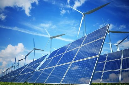 A series of solar panels and wind turbines in the outdoor renewable power plant