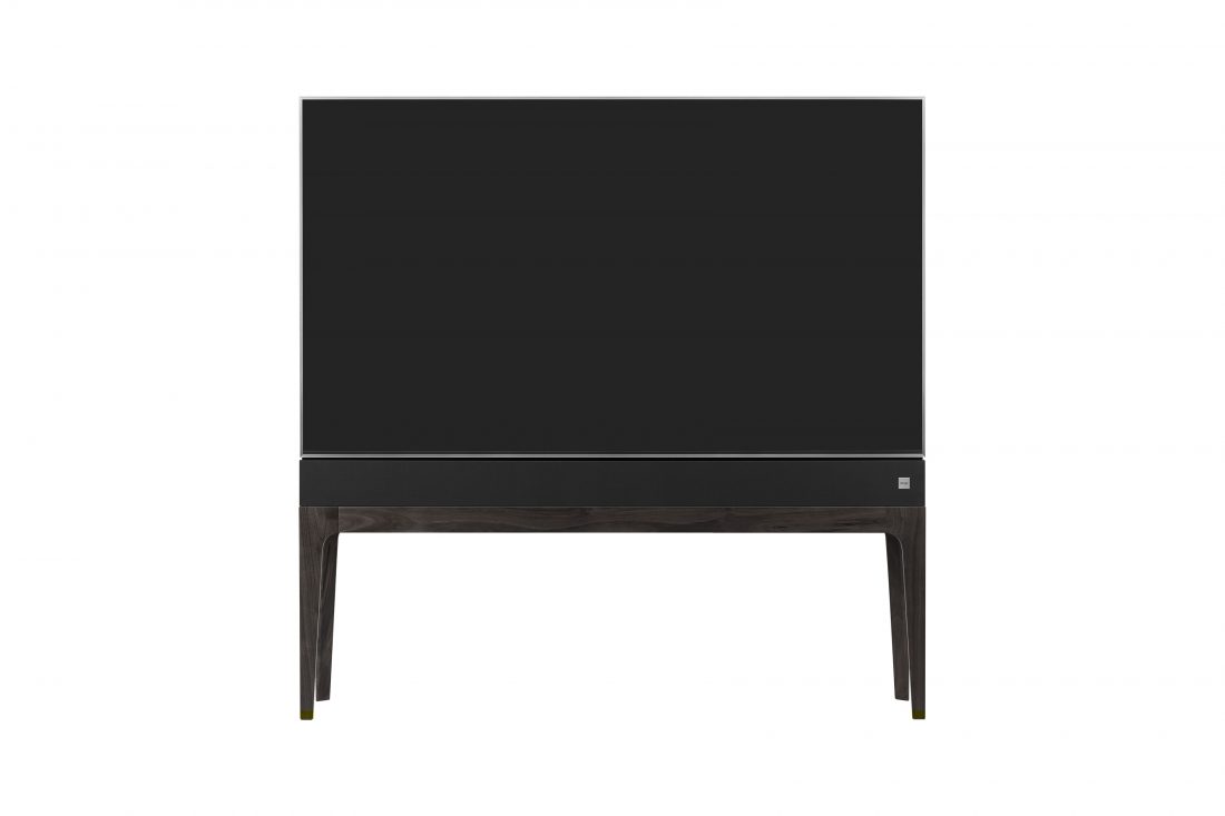 Front view of LG OBJET TV, which is built into a slender cabinet with wooden legs