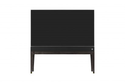 Front view of LG OBJET TV, which is built into a slender cabinet with wooden legs