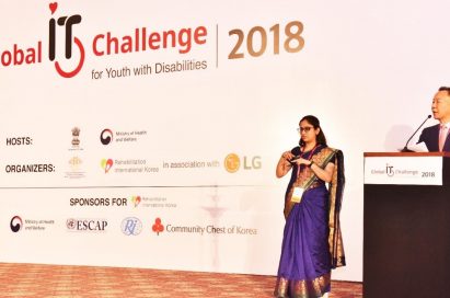 Two presenters announce the start of the 8th Global IT Challenge for Youth with Disabilities on stage, which was sponsored by LG