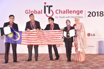Challenge winners from Malaysia hold up their national flag and the award certificate.