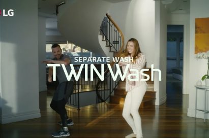 A screenshot from the LG TWINWash Dance Challenge video clip, a man and a woman dance to the music with smiles on their faces