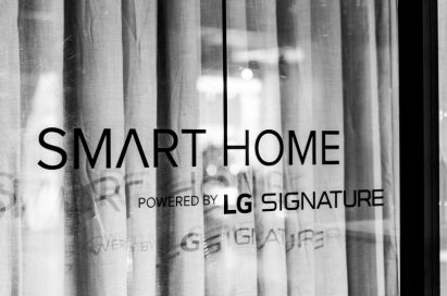 The logo of the “Smart Home powered by LG SIGNATURE” attached on the glass at the event zone