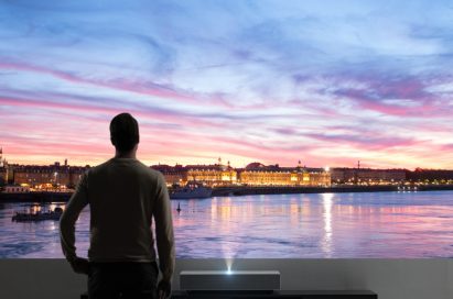 A visitor admiring a vivid image displayed by the LG CineBeam Laser 4K projector model HU85L, which was displayed at CES