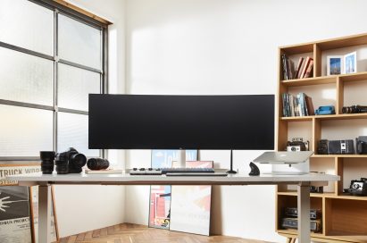 A front view of LG UltraWide monitor model 49WL95 sitting on a desk in someone’s home office