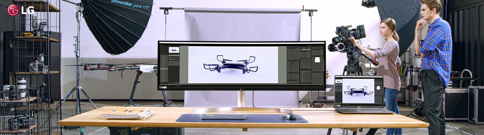 LG UltraWide showing a larger picture taken by two directors on its expansive screen in a studio