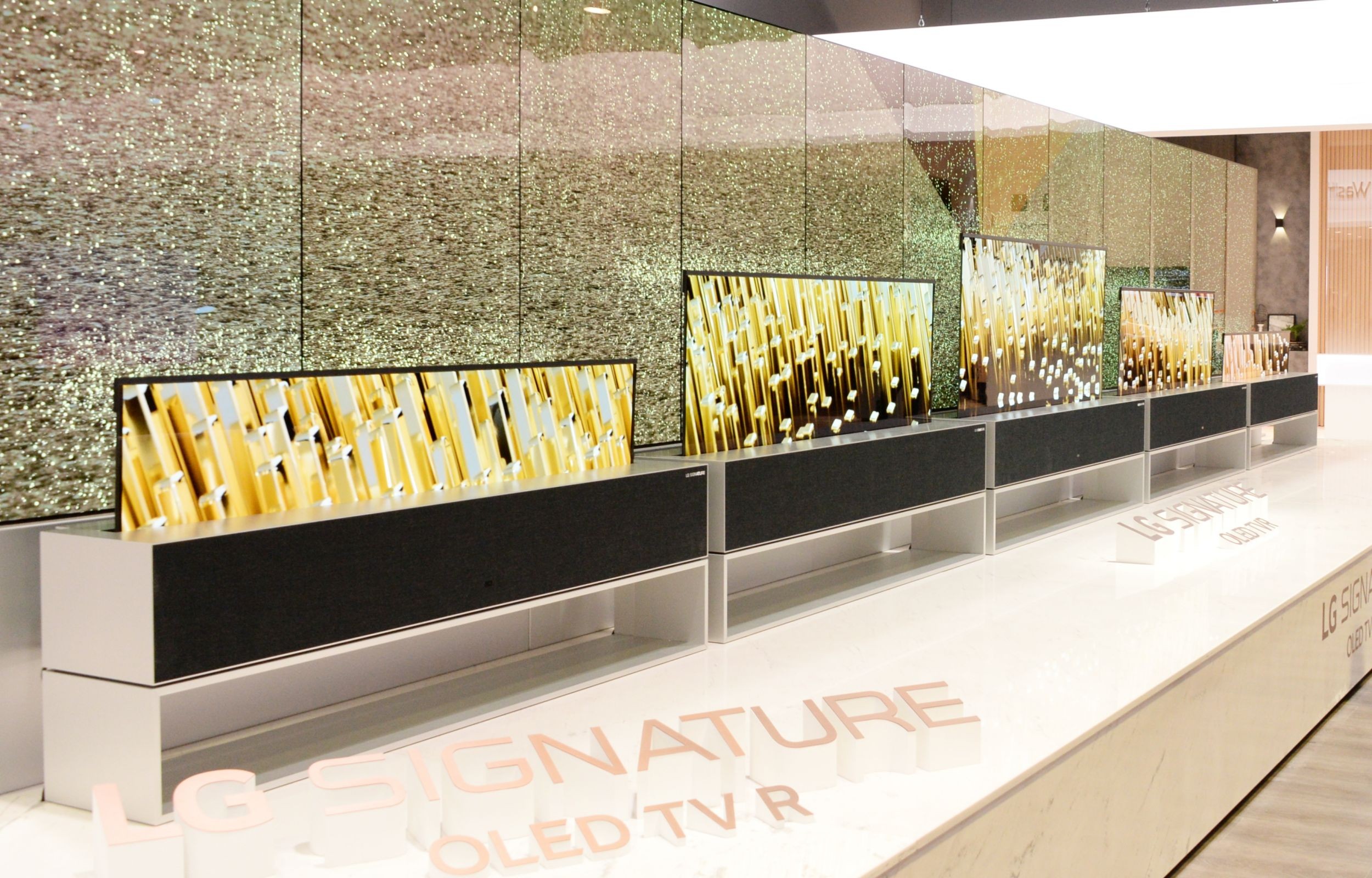 LG OLED TV R displayed in a row and in multiple viewing modes at LG’s CES 2019 booth
