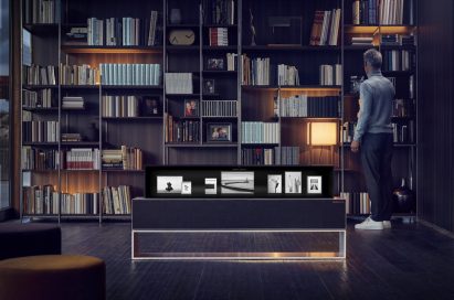 The LG SIGNATURE OLED TV R model 65R9 in its Line View in someone’s study