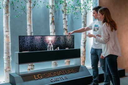 Models pose with LG SIGNATURE OLED TV R.