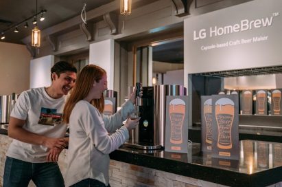 Models pose with LG HomeBrew, the innovative capsule-based device to make craft beer.