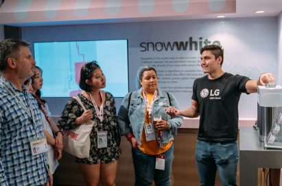 One LG staff member explains LG’s personal ice cream maker prototype, snowwhite.