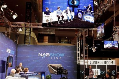 LG’s 55-inch OLED display is hung up above the venue of 2019 NAB Show to play a set of the NABShow Live video content.