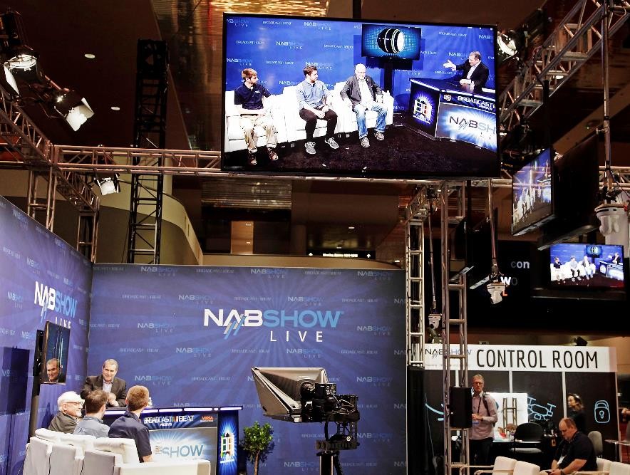 LG’s 55-inch OLED display is hung up above the venue of 2019 NAB Show to play a set of the NABShow Live video content.
