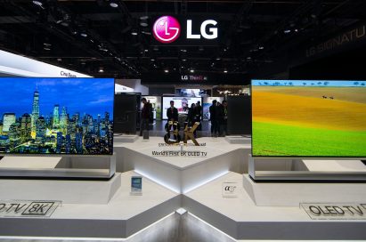 Two LG 8K OLED TVs showing vivid city views and natural landscapes displayed side-by-side