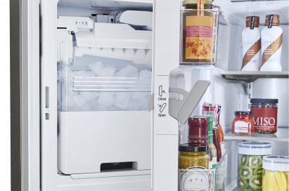 LG refrigerator partially opened to show the interior of its door-ice maker.