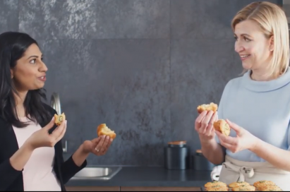Two ladies stand next to each other and discuss the food they cooked using the LG ProBake Convection® oven.