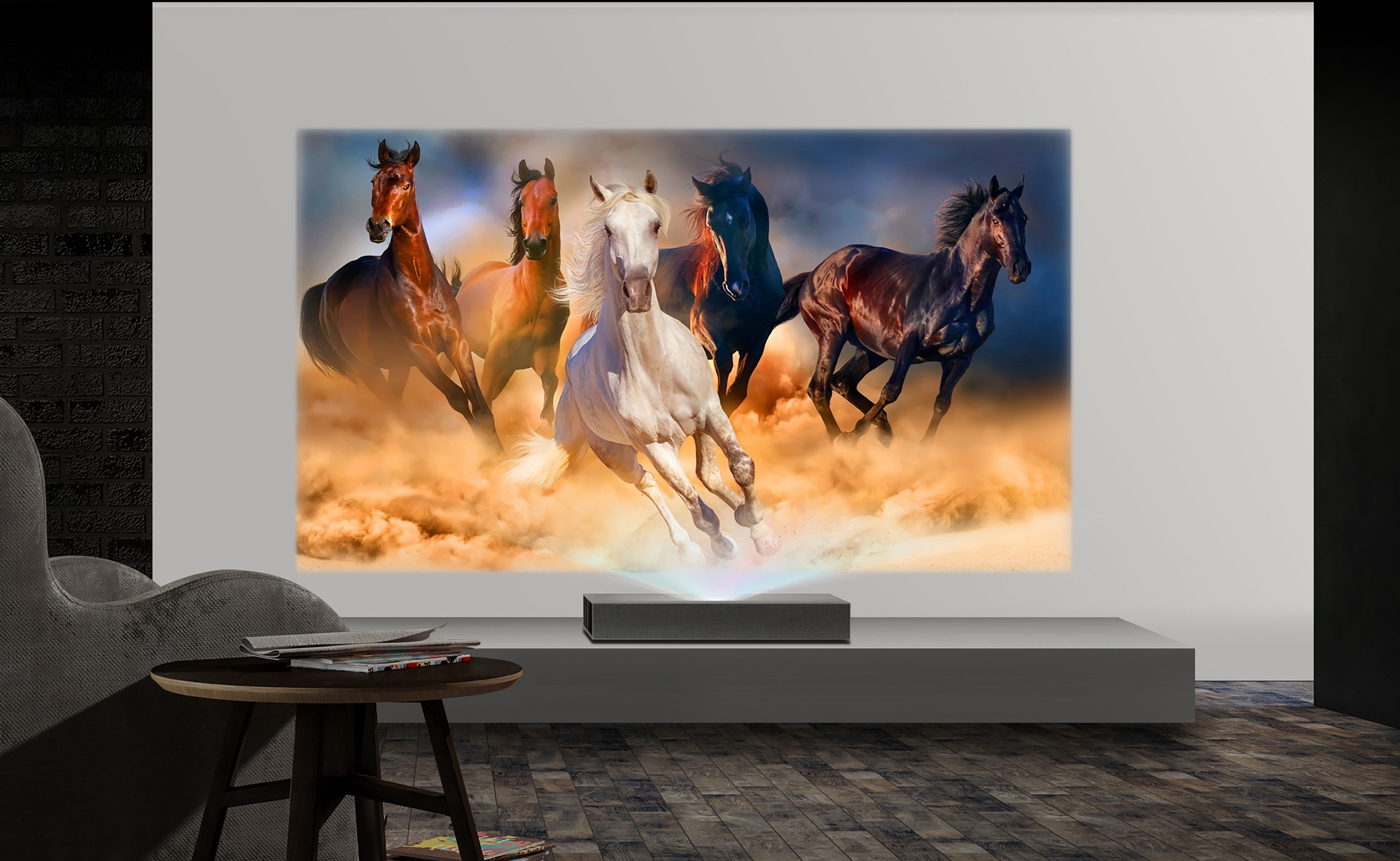 A view of LG CineBeam 4K UHD projector model HU85L producing images of running horses in a low-lit room