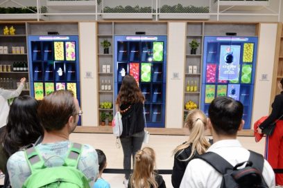 Visitors play the Knock Knock Market card matching game at the LG InstaView Door-in-Door refrigerator highlight zone.
