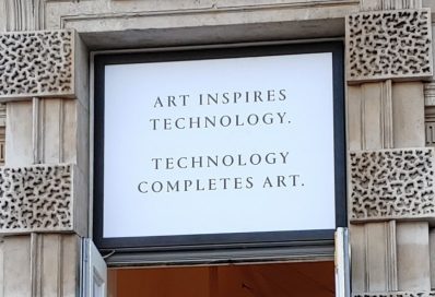 An LG-sponsored billboard saying, “Art Inspires Technology. Technology Completes Art.”