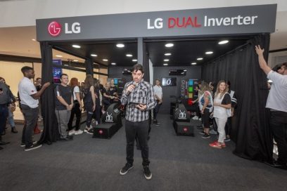 An MC announces the commencement of the LG Dual Inverter Compressor Bike Challenge.