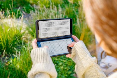 A woman holds the LG G8X ThinQ and the LG Dual Screen horizontally, with the Memo app on the Dual Screen and the LG Smart Keyboard on the main screen