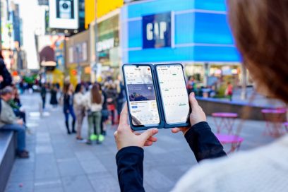 A woman holds the LG G8X ThinQ and the LG Dual Screen like a book, looking at the weather on the Dual Screen and checking the calendar on the main screen