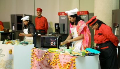 Another view of the participants cooking their Indian food by using LG’s microwave ovens at the LG Mallika-E-Kitchen contest.