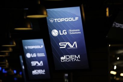 LG’s commercial displays show four brand logos including LG Electronics and Topgolf Entertainment Group on their screens.