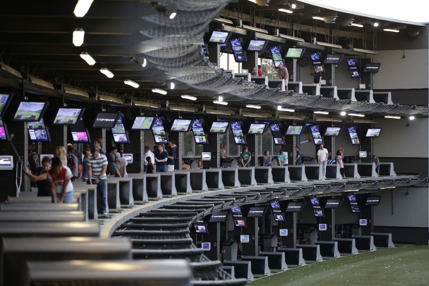 Wide-angle view of a Topgolf venue which uses LG’s commercial digital signage solutions to display information.