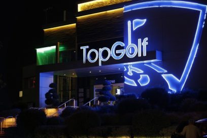 A far shot of a Topgolf venue’s entrance