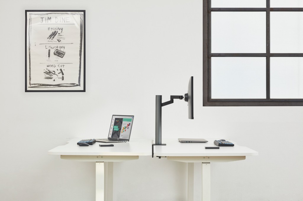 Side view of LG UltraFine Monitor 32UN880 fixed to the desk with the help of its clamp