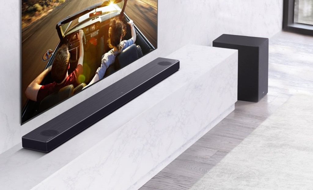 LG Soundbar model SN11RG installed on a shelf under an LG TV as it delivers truly dynamic sounds