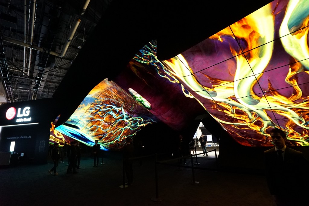 A wide-angle shot of LG Wave in the dark displaying colorful purple, yellow, orange and blues at CES 2020