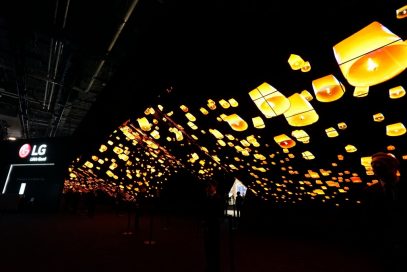 A wide-angle shot of LG Wave in the dark displaying hundreds of glowing lanterns rising into the night sky at CES 2020