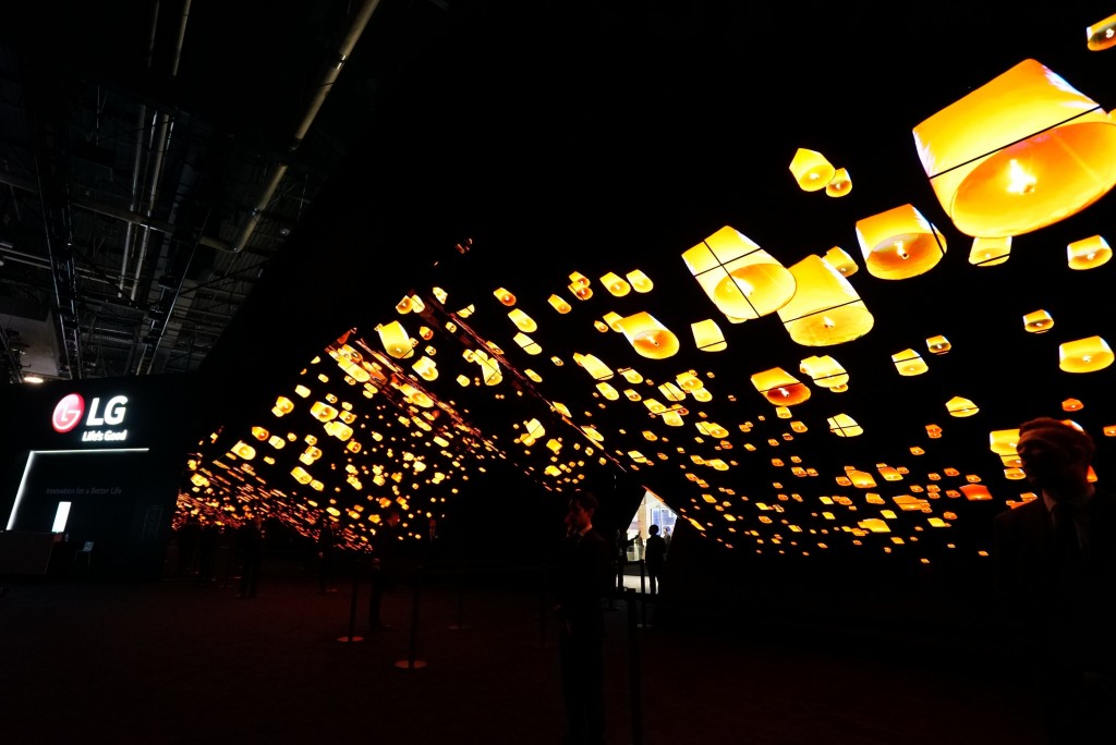 A wide-angle shot of LG Wave in the dark displaying hundreds of glowing lanterns rising into the night sky at CES 2020