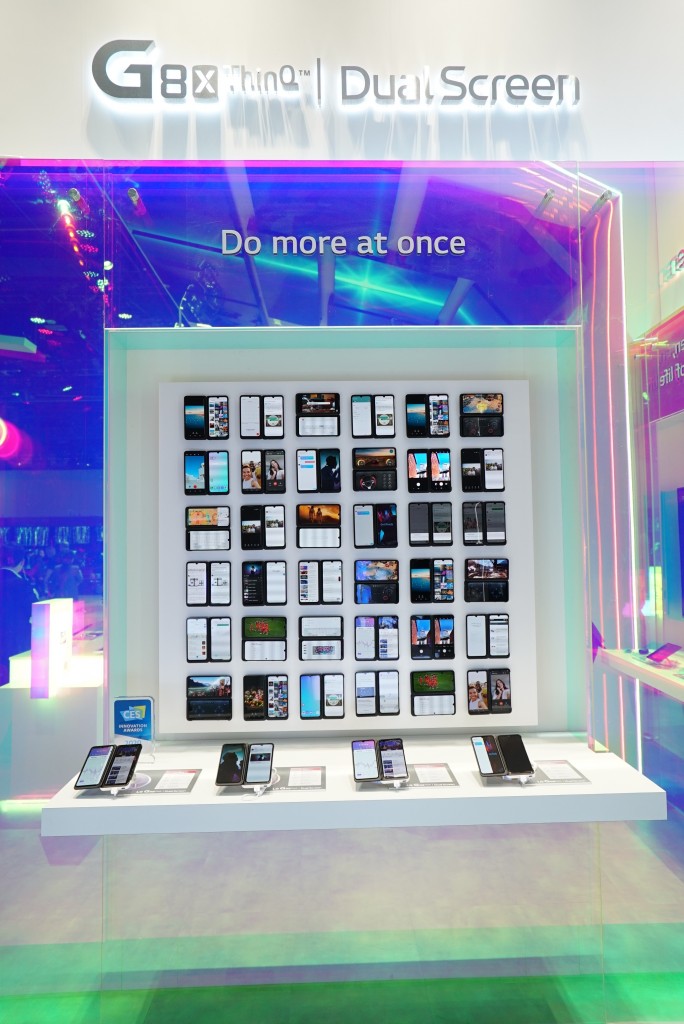 A front view of LG G8X ThinQ’s and Dual Screen’s main display at CES, with four devices placed in front of a large screen illustrating their limitless applications