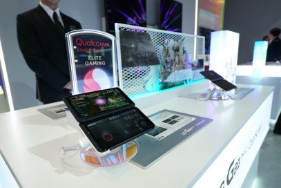 A close-up of two LG G8X smartphones strapped into LG Dual Screen on display in front of a Qualcomm Snapdragon Elite Gaming sign at CES 2020