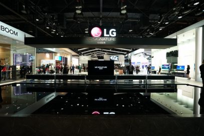The front of the LG SIGNATURE OLED Zone with ten LG SIGNATURE Rollable TVs displayed, one in full view mode and the others concealed in their boxes