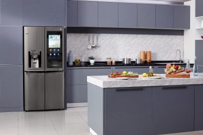 LG InstaView™ ThinQ refrigerator installed inside a modern kitchen with its Smart InstaView touch panel activated.