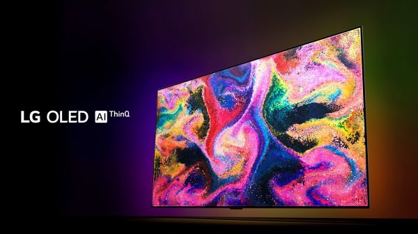 Right side view of LG OLED TV GX emitting vivid, punchy colors in the dark, with the LG OLED AI ThinQ logo on the left