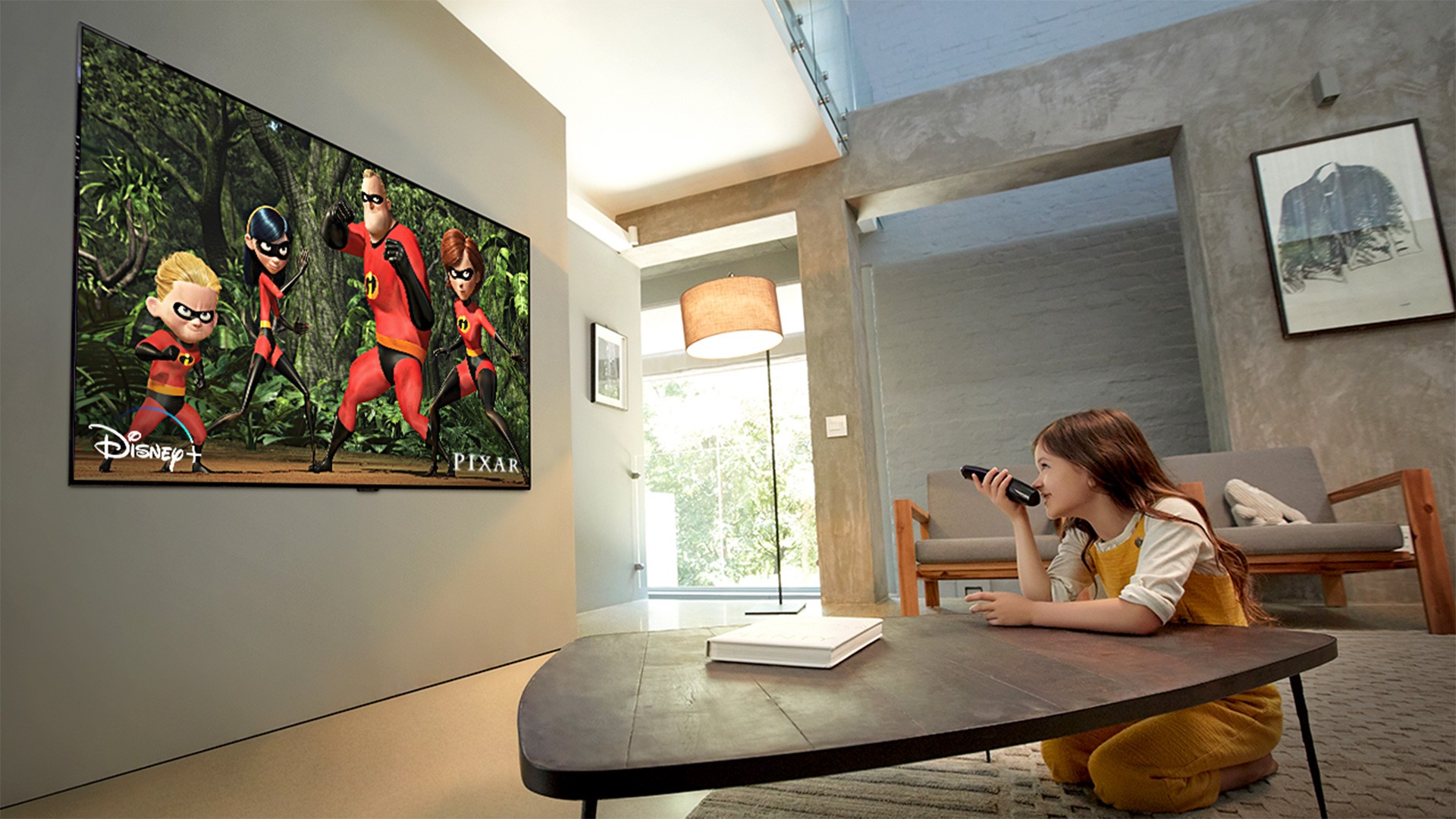 A young girl watches Disney's 'The Incredibles' in her living room via the outstanding picture quality of the ultra-thin LG OLED TV GX
