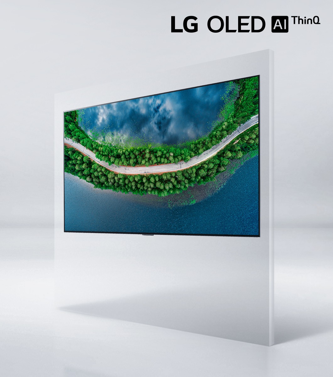 Right side view of LG OLED TV GX displaying a coastal road surrounded by trees, with the LG OLED AI thinQ logo above