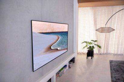 The 65-inch GX Gallery series OLED TV hanging on the wall of a modern living room