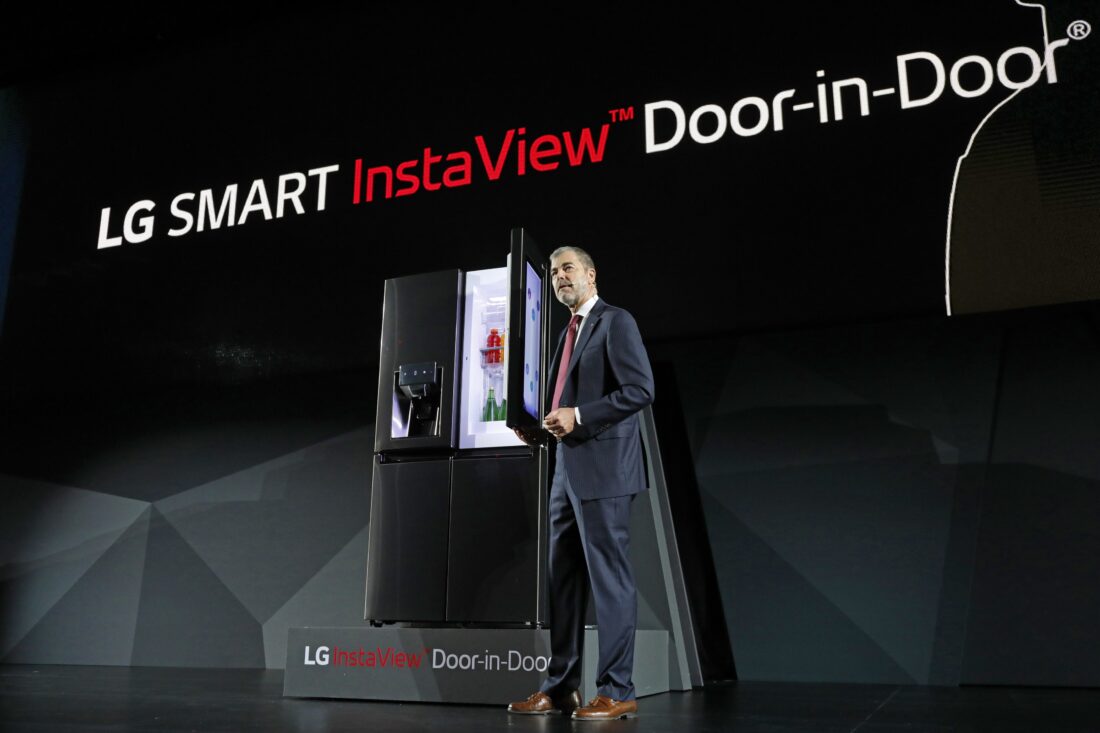 David VanderWaal, Senior Vice President, Marketing, LG Electronics opens the door of LG's InstaView Door-in-Door refrigerator at its CES 2017 Press Conference.