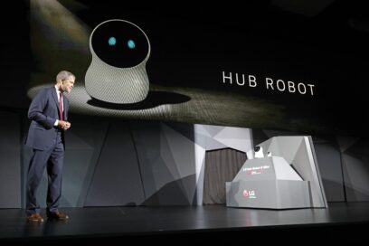 David VanderWaal, Senior Vice President, Marketing, LG Electronics interacts with LG's CLOi Hub Robot at its CES 2017 Press Conference.